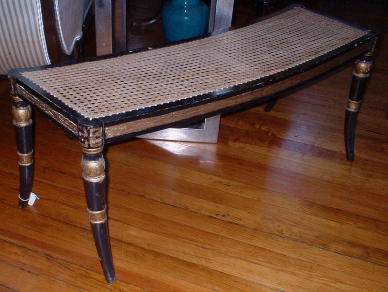 Regency interior window seat with caned seating, sabre legs and gilt decoration