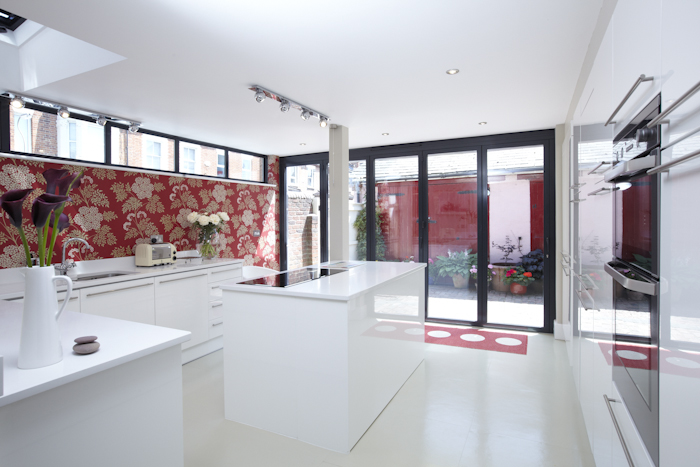 Contemporary kitchen with natural light by Latham Interiors