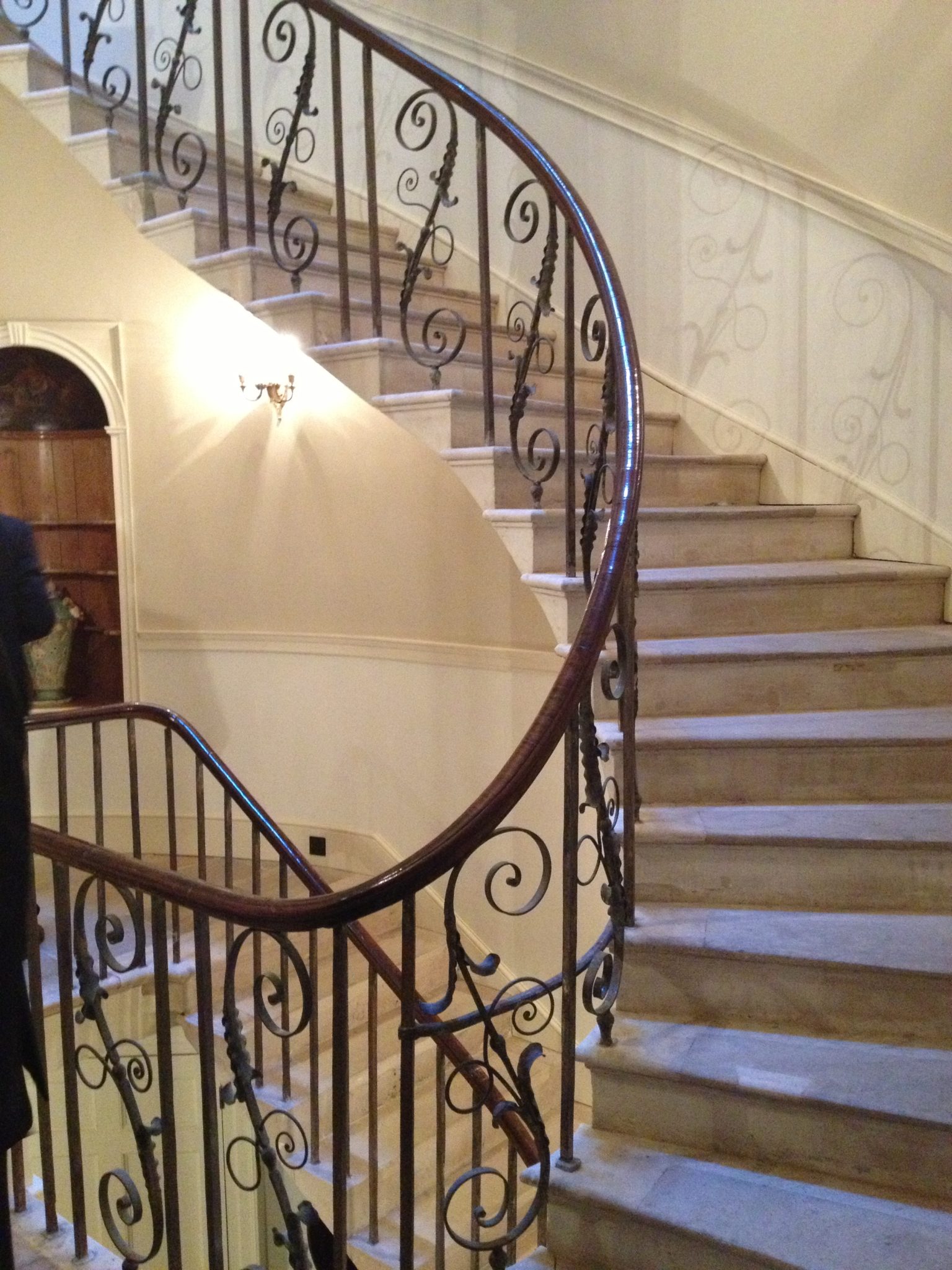 Ornate but elegant iron balustrades. Note the simpler straight iron balustrade design going down to the servats quarters.