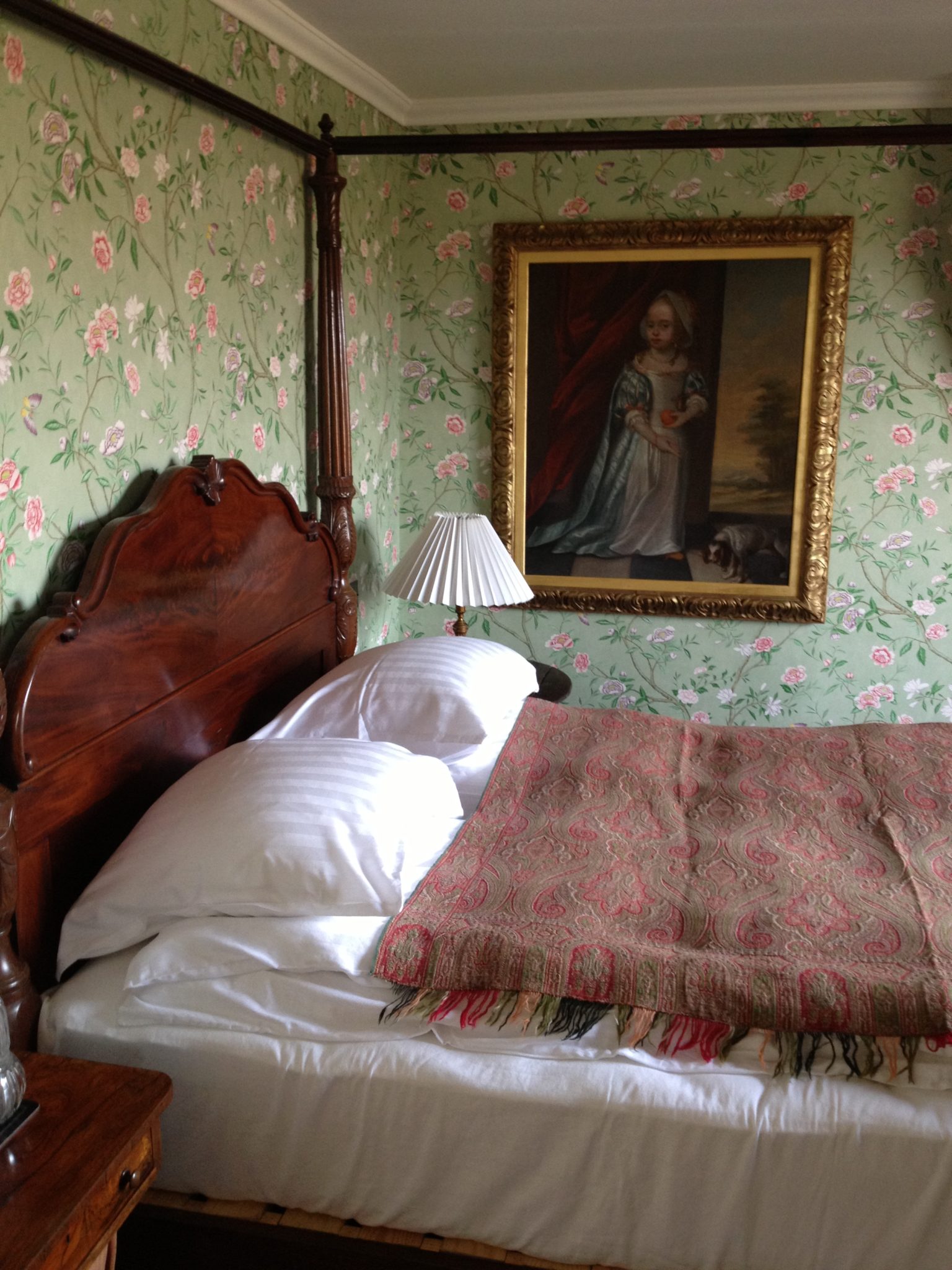 Floral bedroom done in a current wallpaper design from GP&J Baker but very much in keeping.