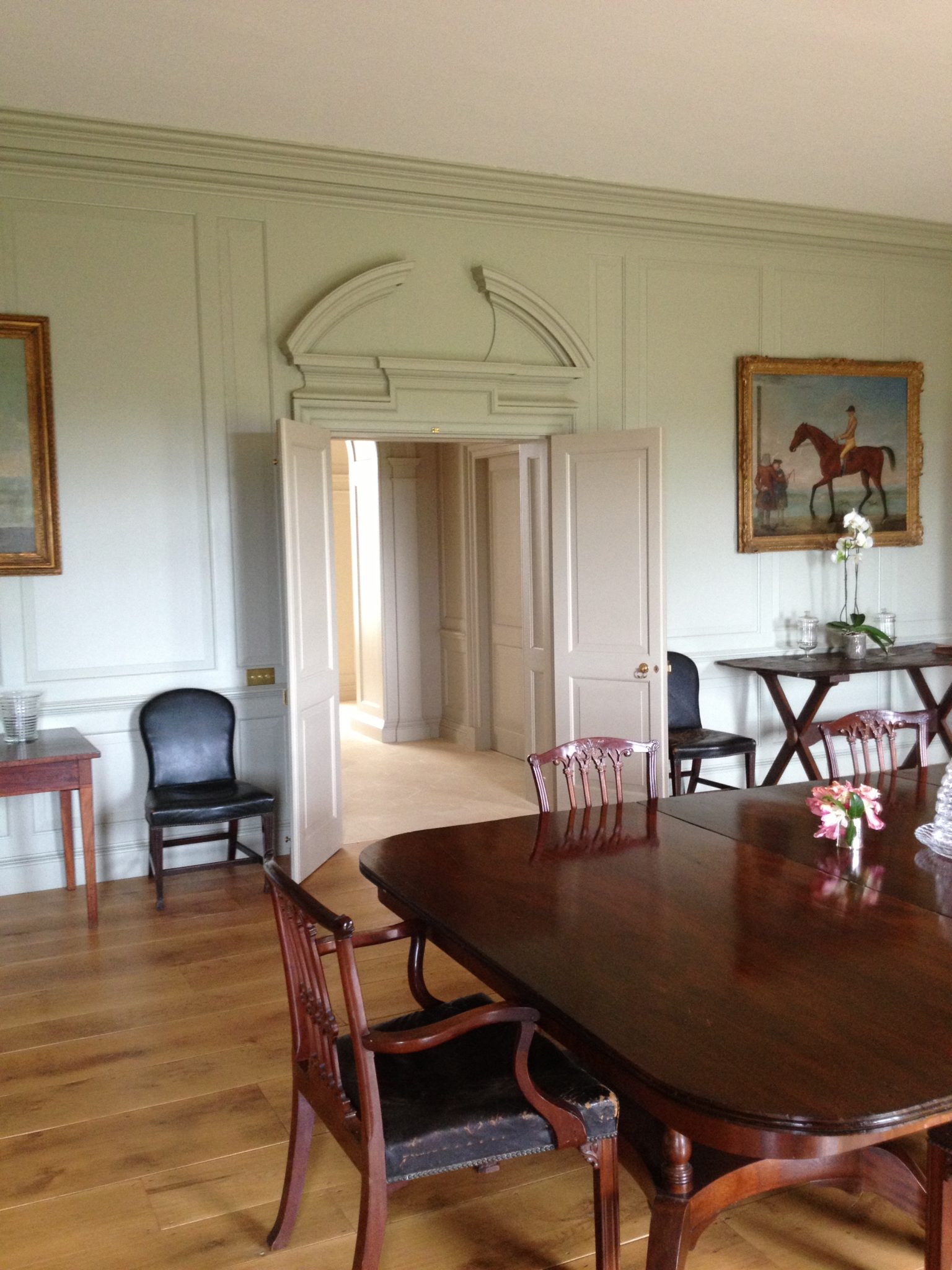 Symmetry is king. The door you can see through these double doors is in fact a false one that mirrors the door to a silver closet on the opposite wall