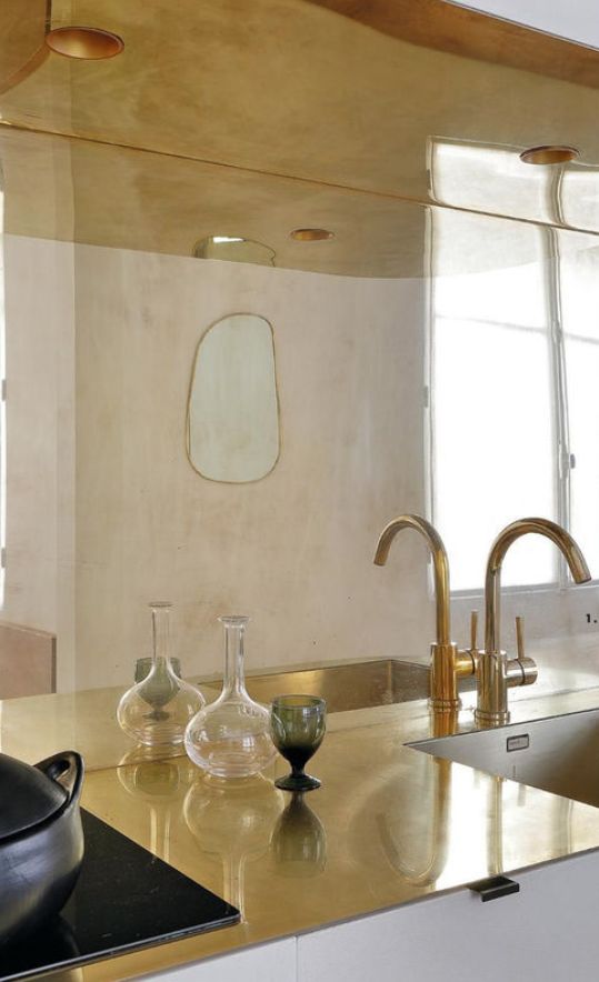 Brass countertop and splashback works well in Georgian Kitchen