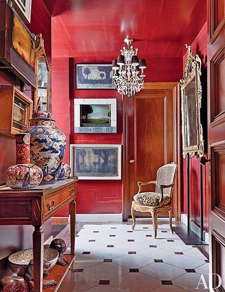 A gloss coloured ceiling adds drama and much needed reflection in a Georgian hallway