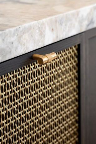 Brass mesh details on cabinets in a Georgian Kitchen Brass mesh details on cabinets in a Georgian Kitchen