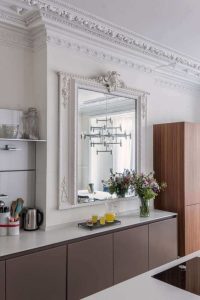 Georgian kitchen with decorative cornice and antique mirror